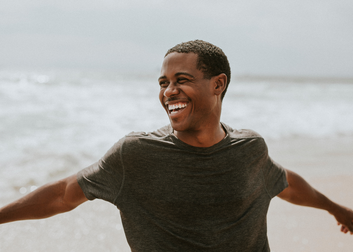 Playful man on the beach