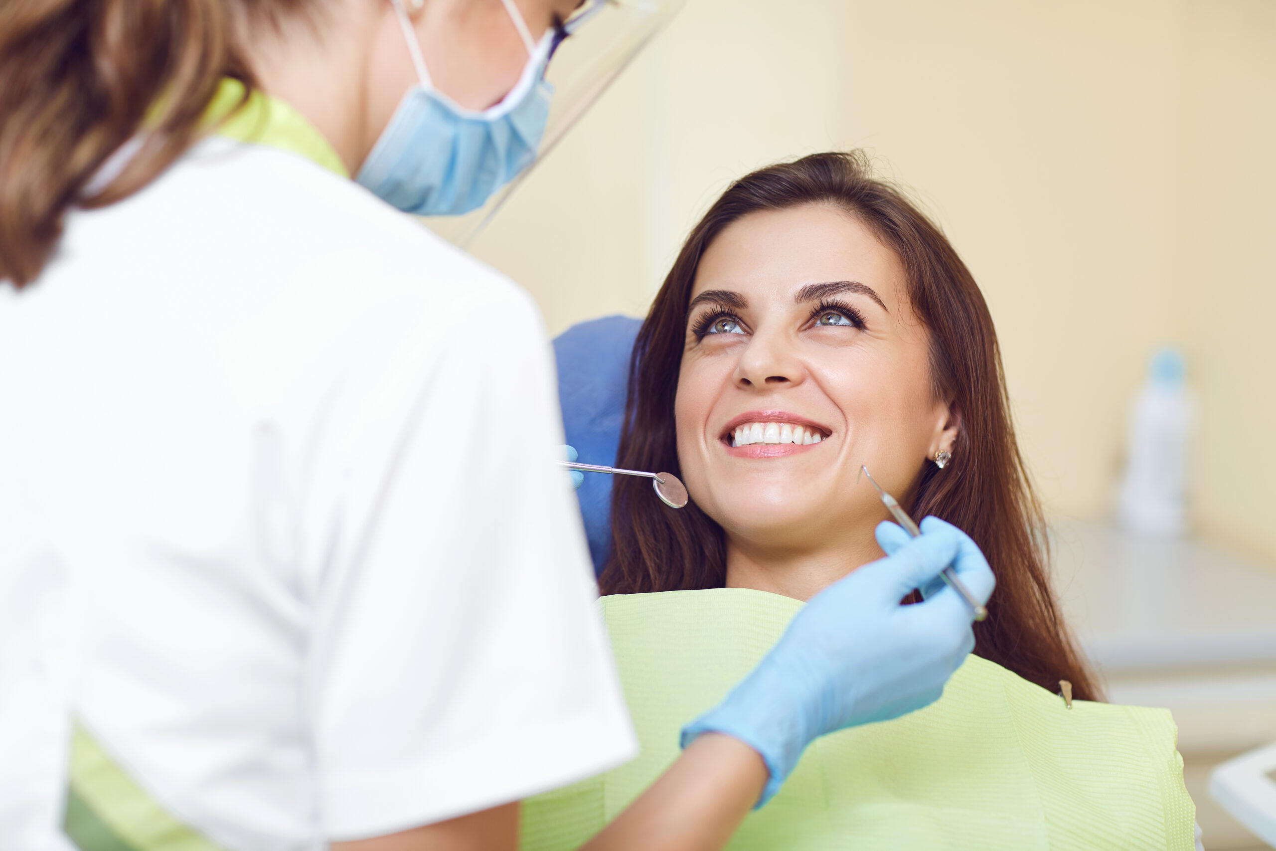 A woman and a dentist in a dental clinic.
