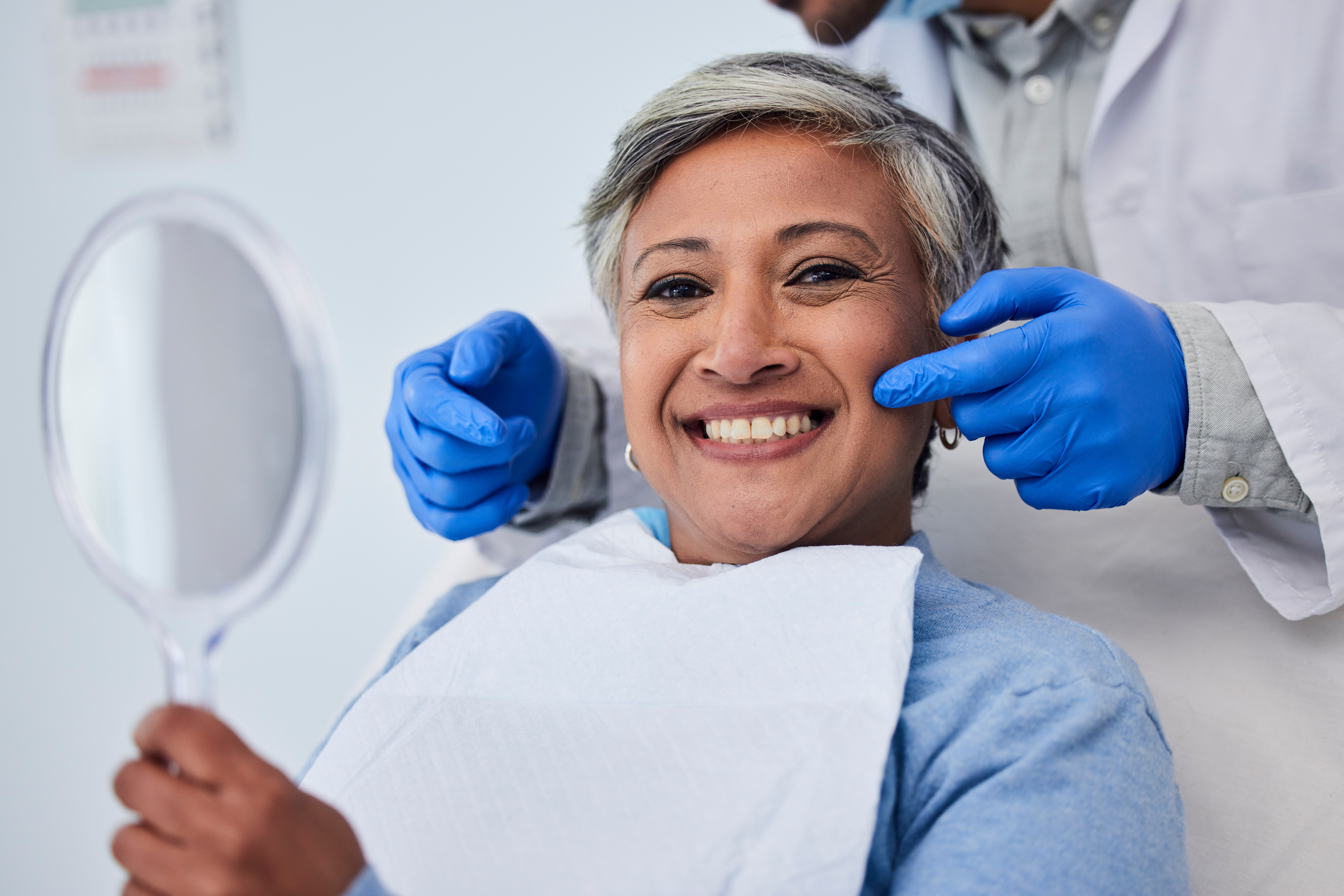 Happy senior woman, teeth and dentist for dental care, appointment or checkup at clinic. Portrait of elderly female person smile for tooth whitening, cleaning or oral, mouth and gum care at hospital.